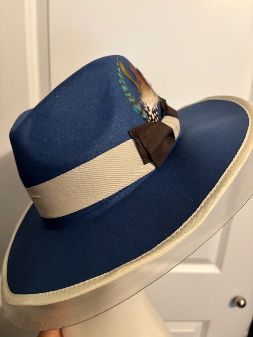 Navy Blue Wide-Brim Fedora with Cream Band and Feather